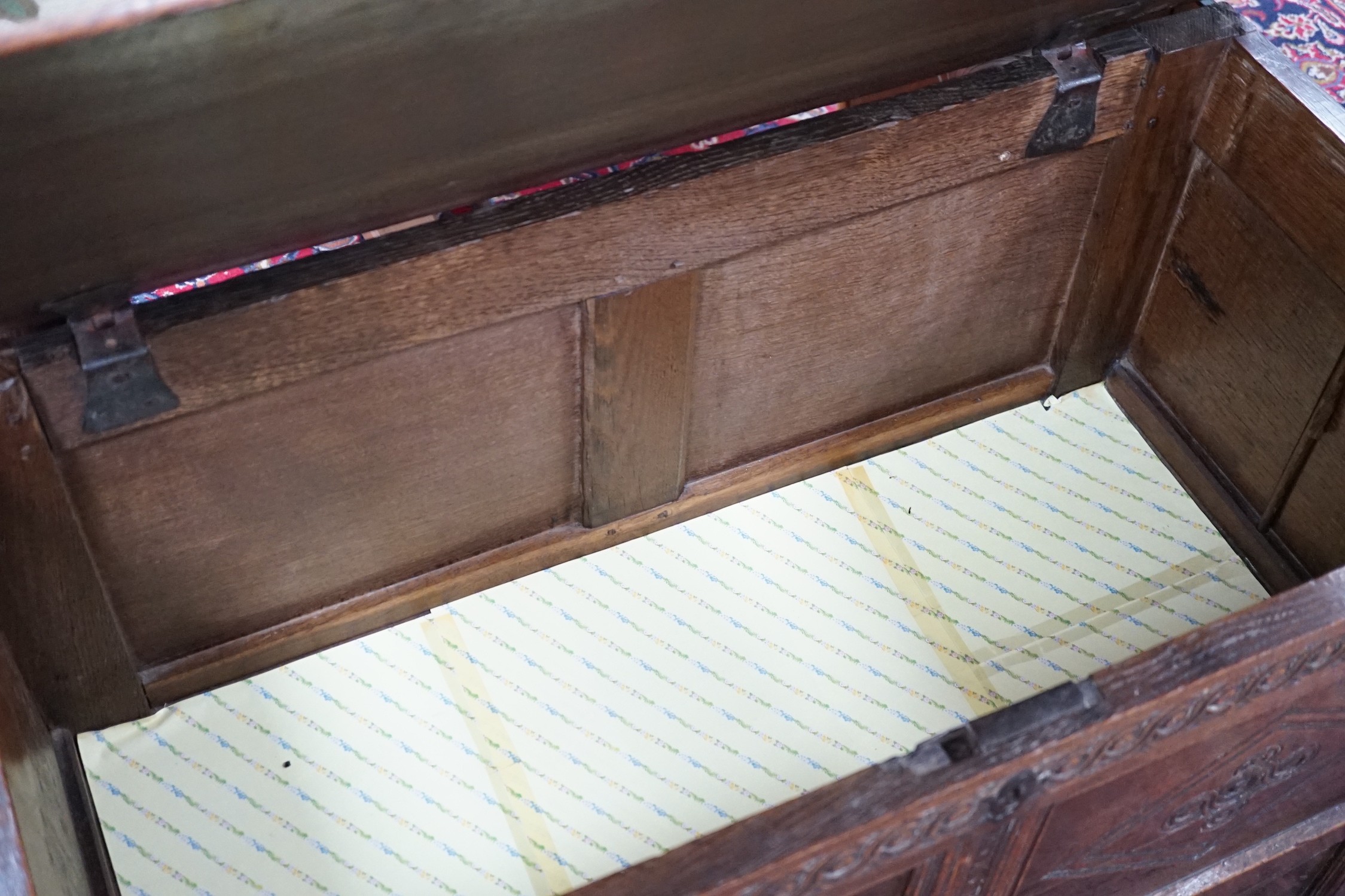 An early 18th century panelled oak coffer, width 96cm *Please note the sale commences at 9am.